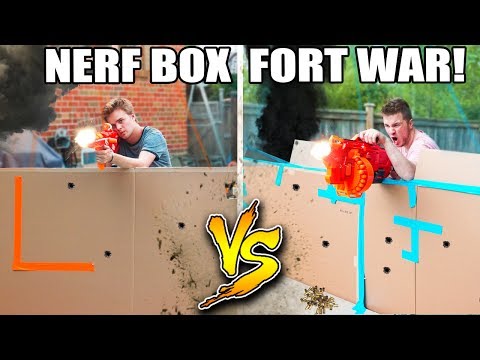 WORLDS BIGGEST BOX FORT NERF WAR! 1v1 NERF BATTLE! Video