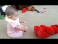 Avery Tickling Elmo As She Sits Up By Herself