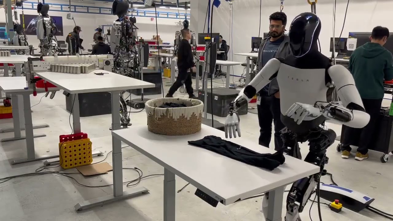 Tesla Bot Optimus is folding laundry!