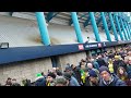 Cheering Norwich fans leaving the New Den victorious after Norwich's 3-2 win over Millwall 04/03/23