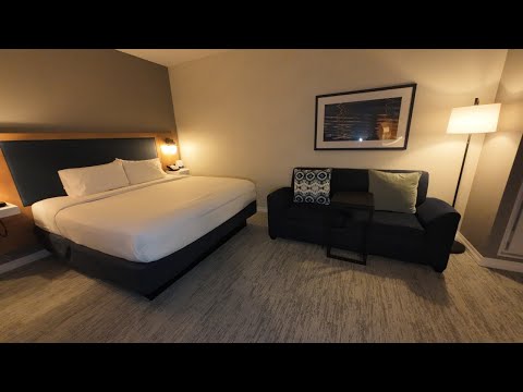 Hampton Inn Boston Seaport District Hotel - King Bedroom With A Sofa Bed Room Tour