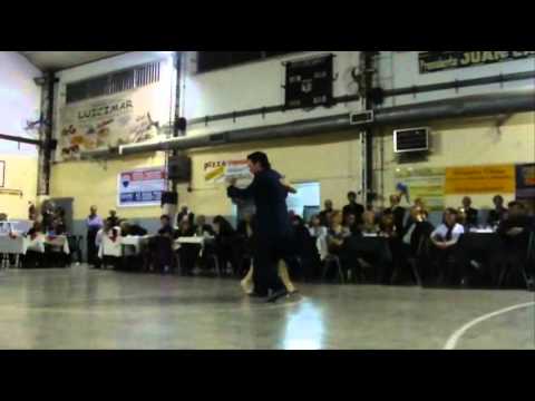  Paola Tacchetti  and  Ernesto Candal  are  dancing  to  the  milonga  "  Milonga, Vieja Milonga  "