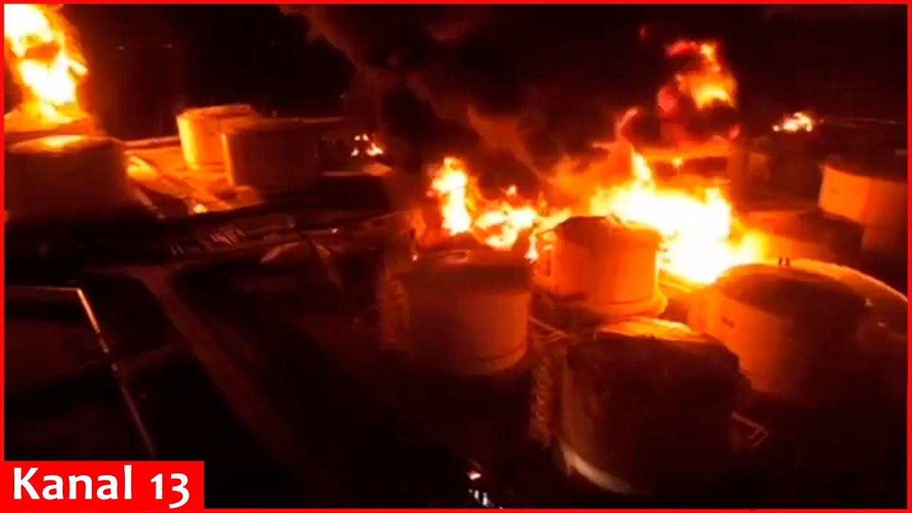 Footage of intense fire in oil tanks following a strike on an oil terminal in Crimea