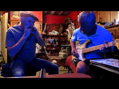 Harmonica & Electric guitar blues. Song starts at 50 seconds