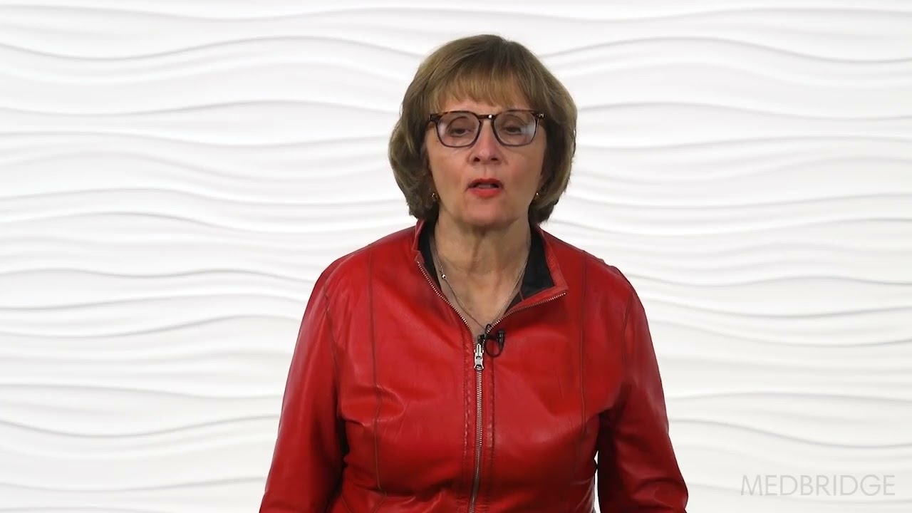 A glasses-wearing person in a red jacket speaks against a textured white background with the medbridge logo.