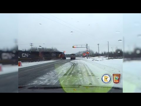 Officer finishes semi truck inspection -- then watches the truck drive into oncoming train