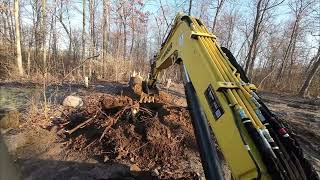 Digging stumps with excavator...first time operating
