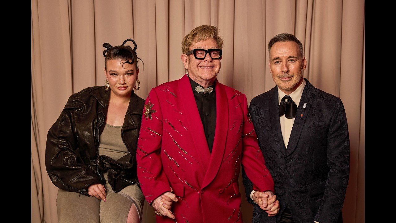 Elton John introduces Lola Young at the 34th Elton John AIDS Foundation Oscar Party