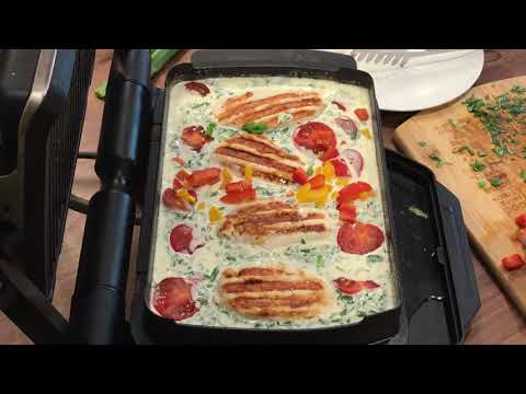 Chicken in basil cream sauce topped with mozzarella