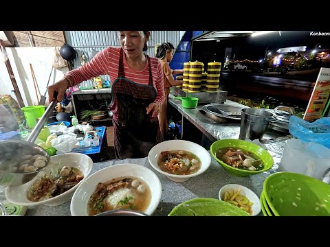 Eating hot noodle soup after a long day, street food in Laos