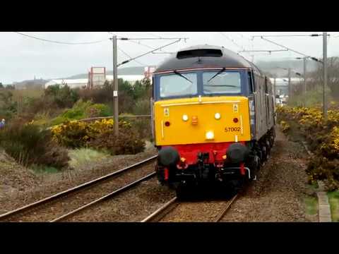 DRS 57002+57003 passing Prestwick Town station with the Hunterston Ll Drs-Sellafield B. N. F. move.