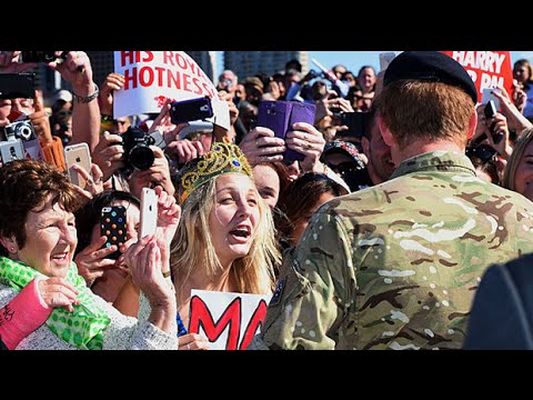 Prince Harry stuns fan holding 'marry me' sign with kiss on cheek