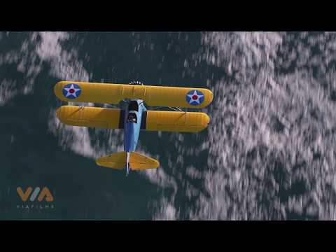 Vintage Stearman Biplane flying over Oregon Coast