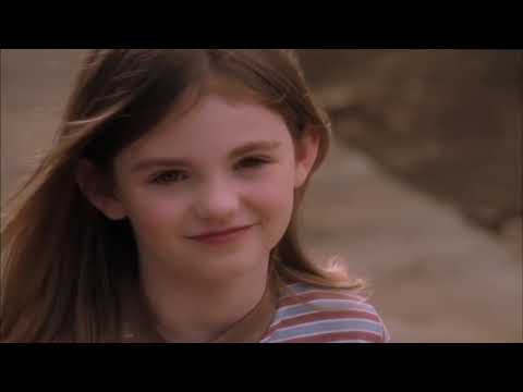 Flipped trailer frame: the final yard scene where a sapling takes root, signaling reconciliation