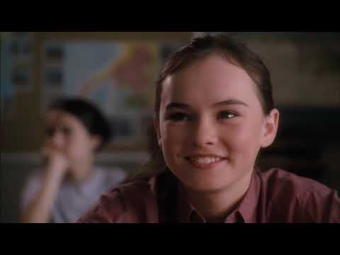 Flipped (2010) trailer frame: Juli and Bryce in a sunlit suburban street, early-’60s Americana tone