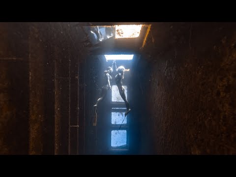 Two world record holding freedivers explore a deep wreck