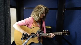 Recording acoustic guitar on the SXSW trade show floor with Vicki Genfan