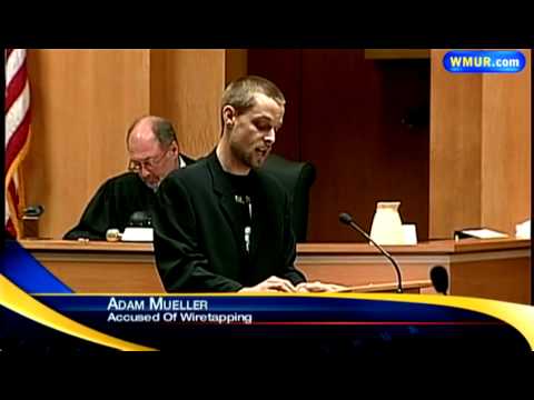 Wiretapping suspect enters court to applause