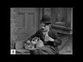 Charlie Chaplin saves Scraps from a wild pack of dogs - From 