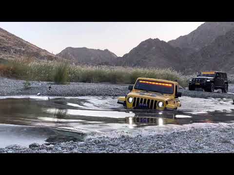 Jeep Rubicon JL crossing deep water.