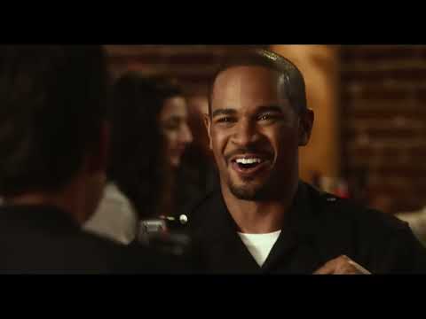 Let’s Be Cops official trailer still with the faux-cop duo in full uniform
