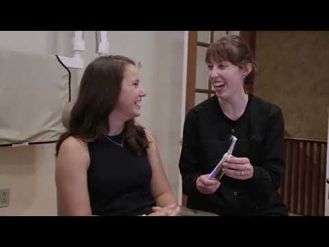 Attleboro dental team member showing a patient an electric toothbrush