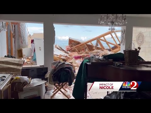 Homeowner shows inside of her collapsed home after Hurricane Nicole