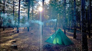 Hot Tent Camping In Woods Cooking Steak Over Wood Stove