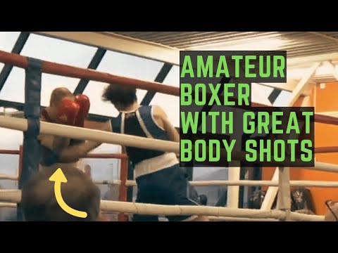 Amateur boxer throwing hard body shots and giving different looks