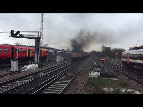 Hellfire 31233 spilling its guts with 37175 at Clapham Junction
