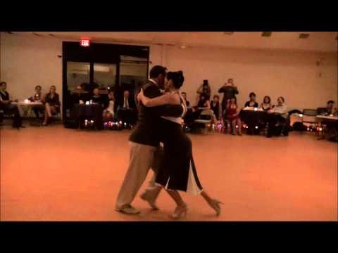  Jesica Arfenoni  and  Maximiliano Cristiani  are  dancing  to  the  tango  "  Café Domínguez  "  by  Ángel D'Agostino