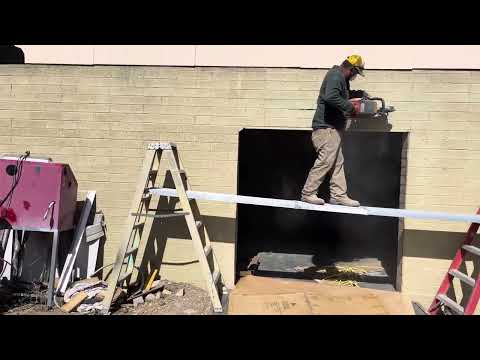 INSTALL A LINTEL IN BLOCK WALL TO ENLARGE OPENING FOR DOOR.