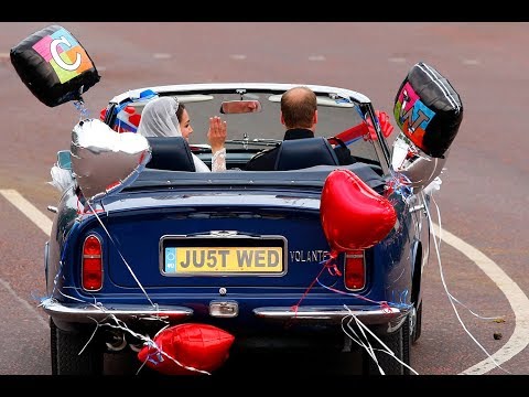 The Duke and Duchess of Cambridge leave Buckingham Palace in an Aston Martin