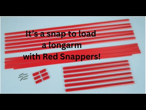 Red Snapper loading a quilt on the longarm frame. 