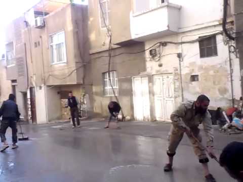 مشاركة كتيبة حمزة أسد الله بتنظيف مخلفات القصف في حي جوبر في مدينة دمشق