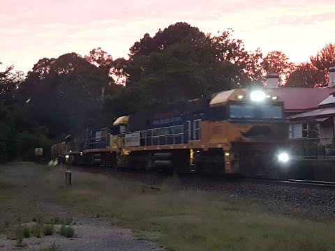 NR66 "Movember" leads PN Steel Freight 1MP2 past Aldgate Railway Station at Sunrise - 08/02/2021