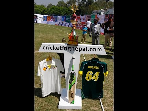 Bashant Choudhary and Wally Edwards shows jersey and bat of Phil Hughes
