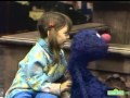 Sesame Street Heather Scatches Grover S Back