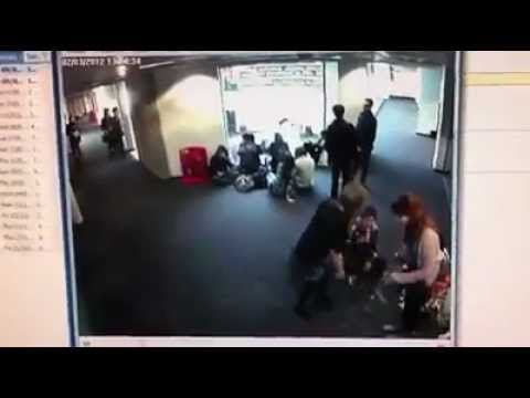 Girl Face plants floor while using crutches.