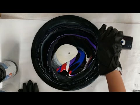 Acrylic pour on a vinyl record with Artist's loft ready-mixed pouring paint