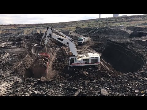 Caterpillar 385C Excavator In White Color Loading Coal On Trucks