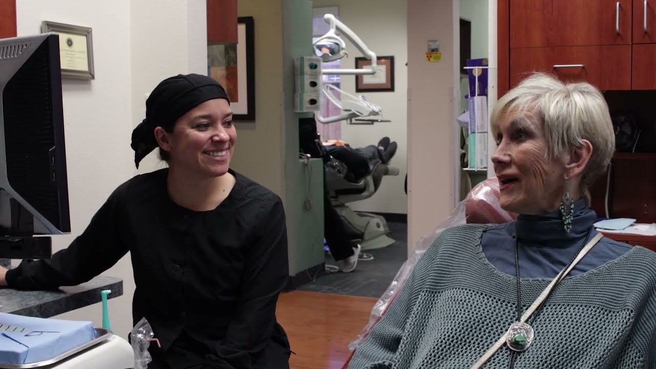 Southlake dental team member talking with dental patient