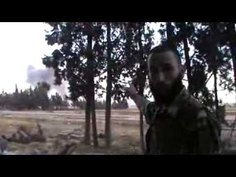 قائد كتيبة الصمود جنود الله يشرح كيفيه قصف بلدة الغنطو في ريف حمص بالبراميل المتفجرة