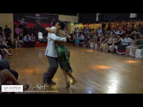  Yanina Quiñones  and  Neri Piliu  are  dancing  to  the  tango  "  Yuyo Brujo  "  by  Juan D'Arienzo  at  Singapore International Tango Festival  in  2017
