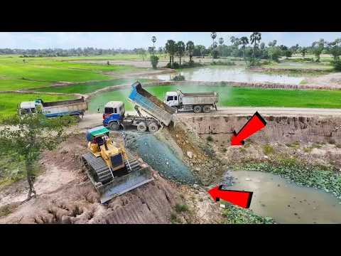 Fantastic Motion! Using multiple dump trucks, dozers D60P push rock and dirt