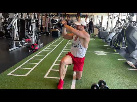How To Perform A Kneeling Dumbbell WoodChopper Exercise