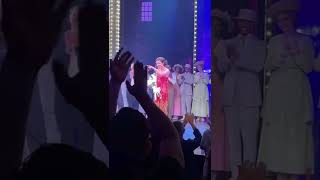 Lea Michele pointing at Jonathan Groff during the curtain call for funny girl opening night