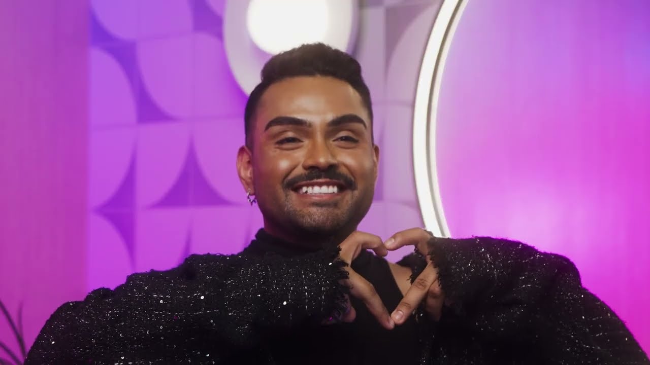 MAN CREATING A HEART SHAPE WITH HIS FINGERS