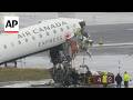 2 pilots killed after plane crashes with fire truck at LaGuardia Airport