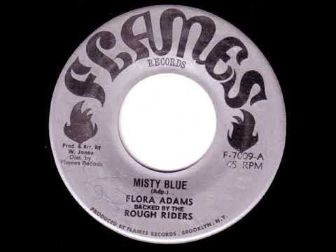 Flora Adams backed by the Rough Riders  Misty Blue